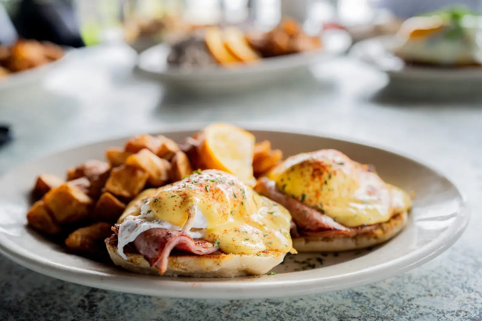 Eggs Benedict with Hollandaise and breakfast potatoes at Harbor House Kona