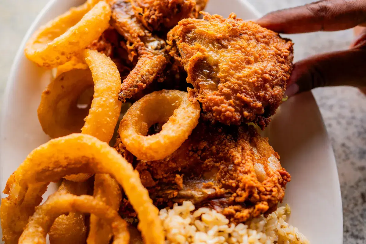 Crispy fried chicken with onion rings and rice at Harbor House Kona