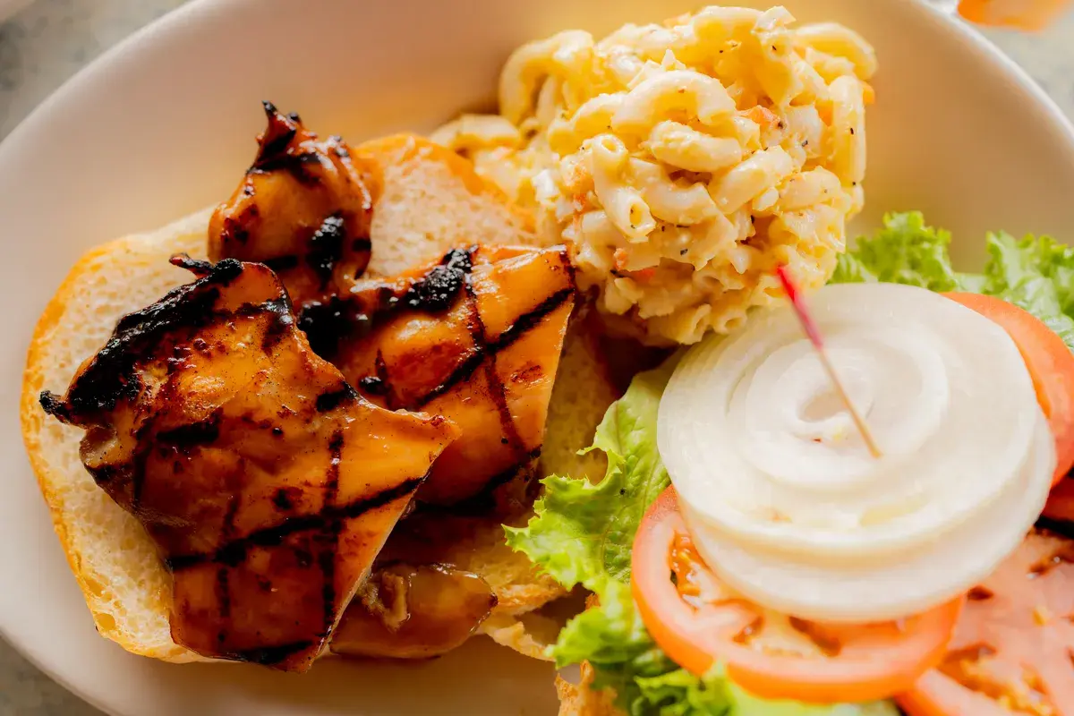 Grilled chicken sandwich with mac salad at Harbor House Kona