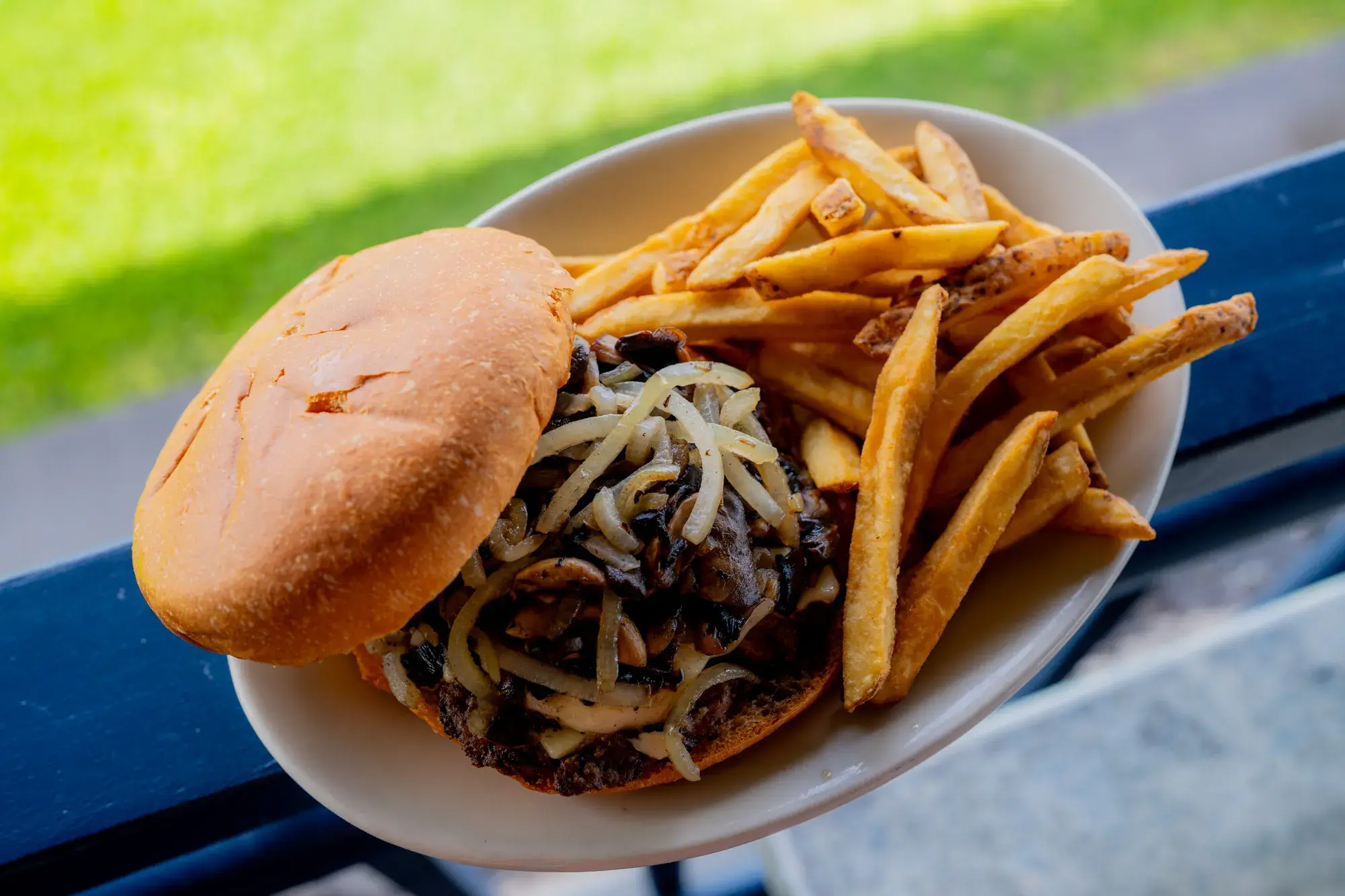 Mushroom Swiss Burger at Harbor House Kona, Mushrooms, grilled onions, and Swiss cheese.