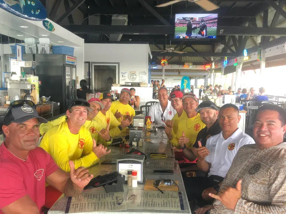 Kona lifeguards and first responders sharing lunch at the Harbor House counter