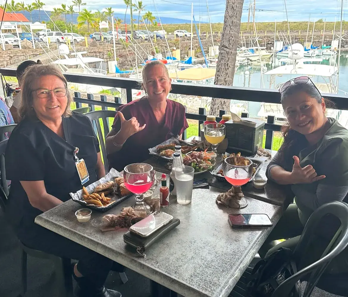 Nurses enjoying a Locals Night dinner with drinks at Harbor House overlooking the marina