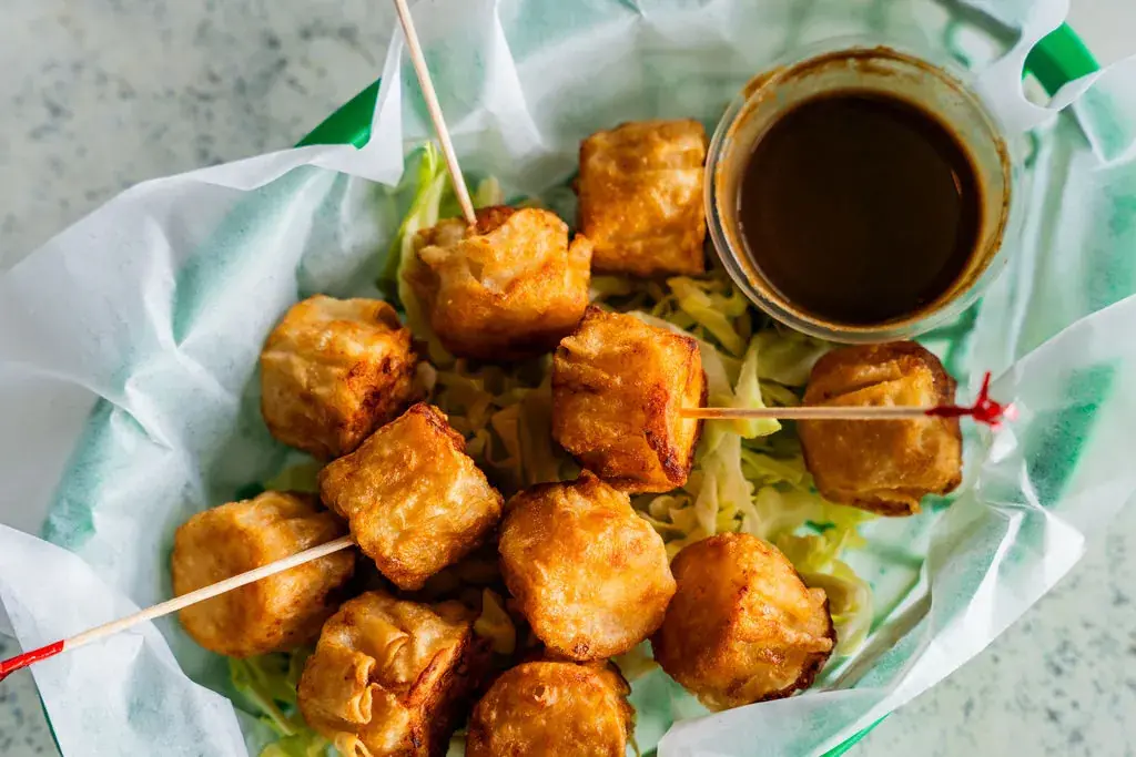 Crab Stuffed Wonton, golden-fried with sweet chili and kabayaki sauce at Harbor House Kona