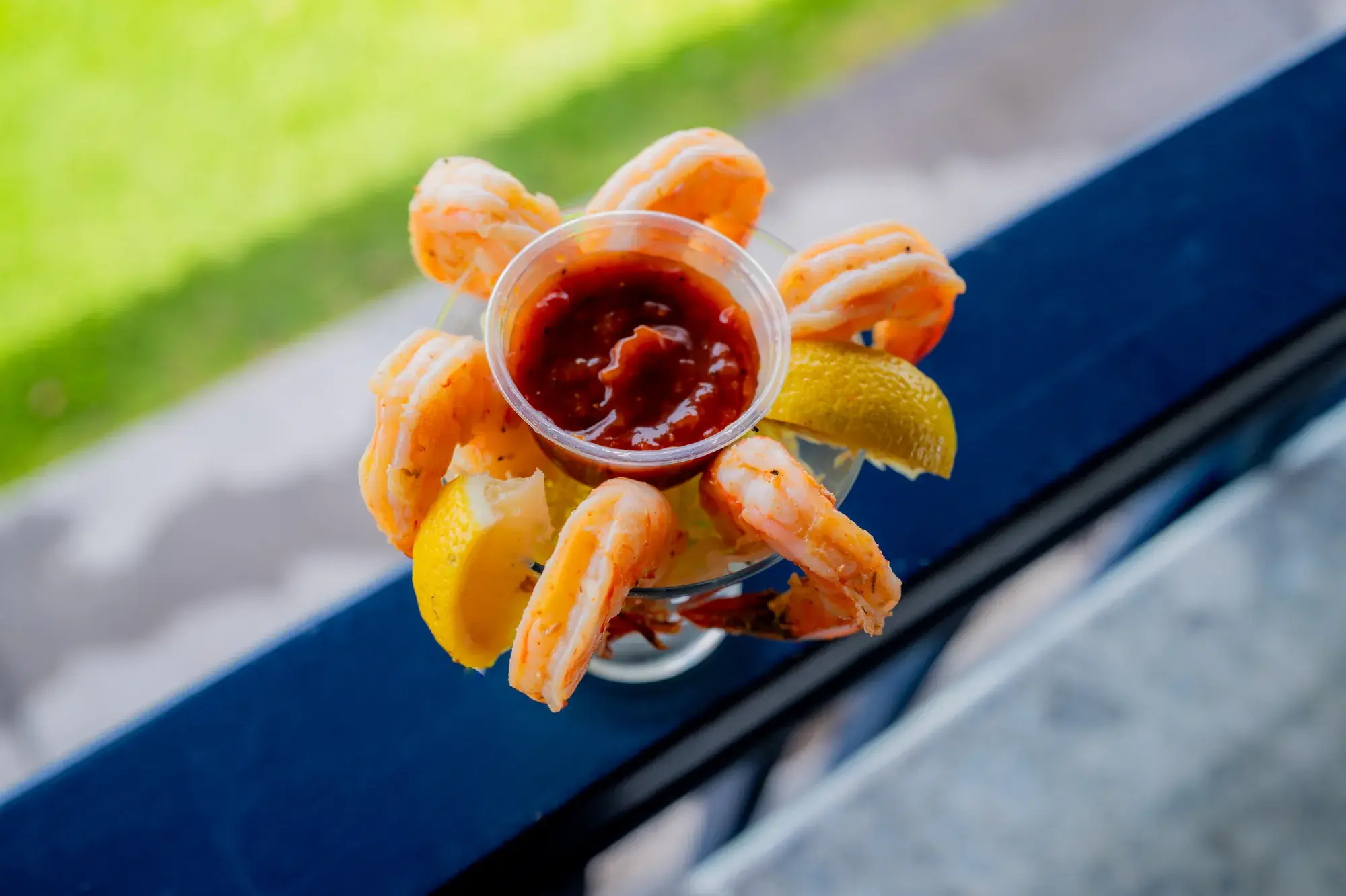 Shrimp Cocktail (6) at Harbor House Kona, Cocktail sauce, lemon wedge.